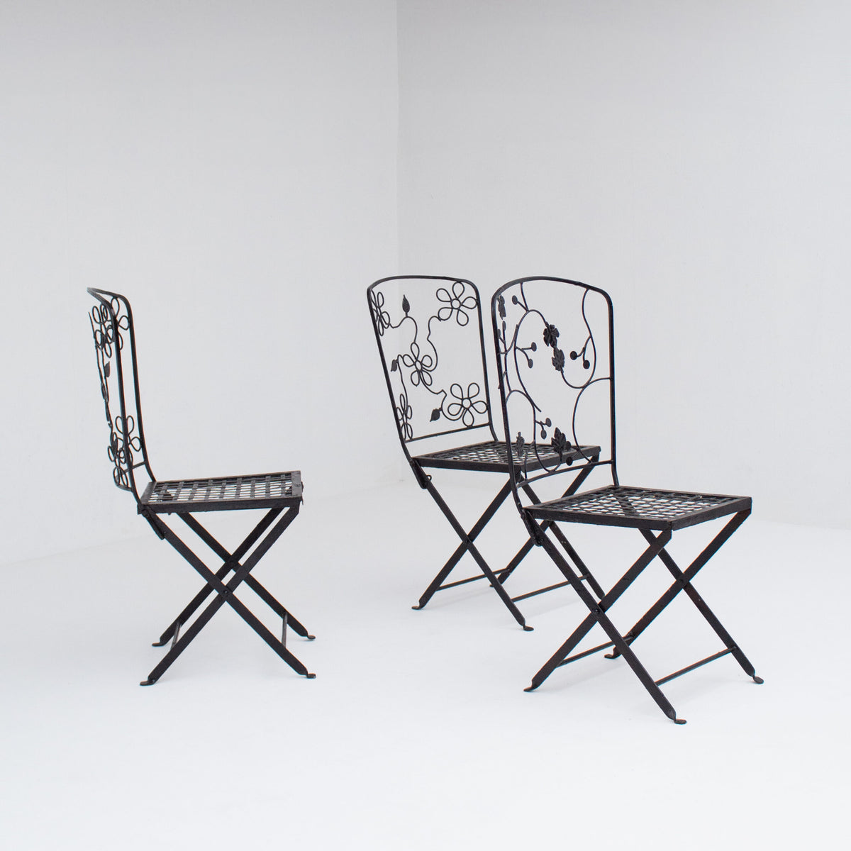 Set of Three Decorative Wrought Iron Garden Chairs with Floral Backrests — detail view