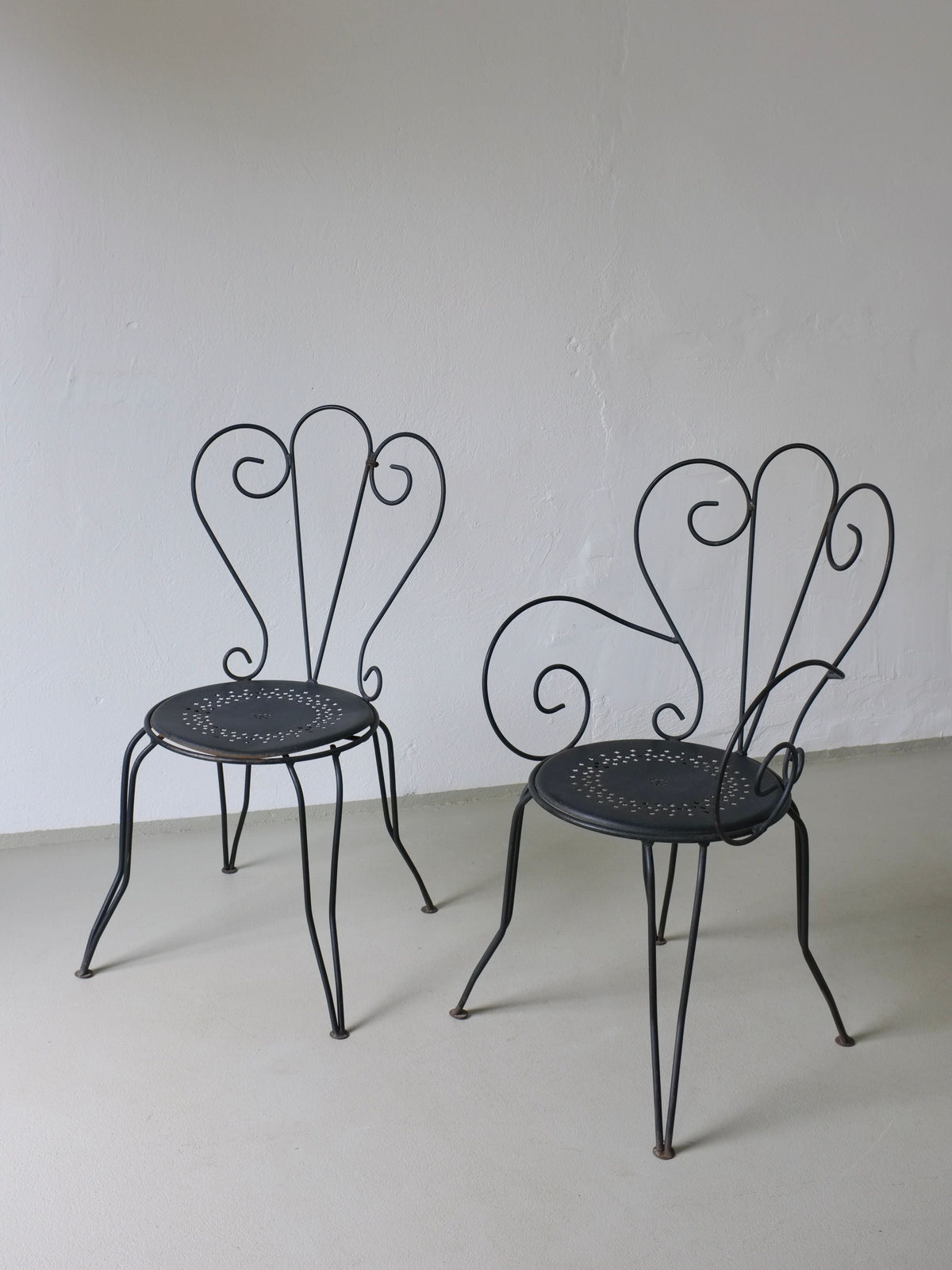 Wrought Iron Garden Dining Set, 1950s France — close-up of black wrought iron chairs