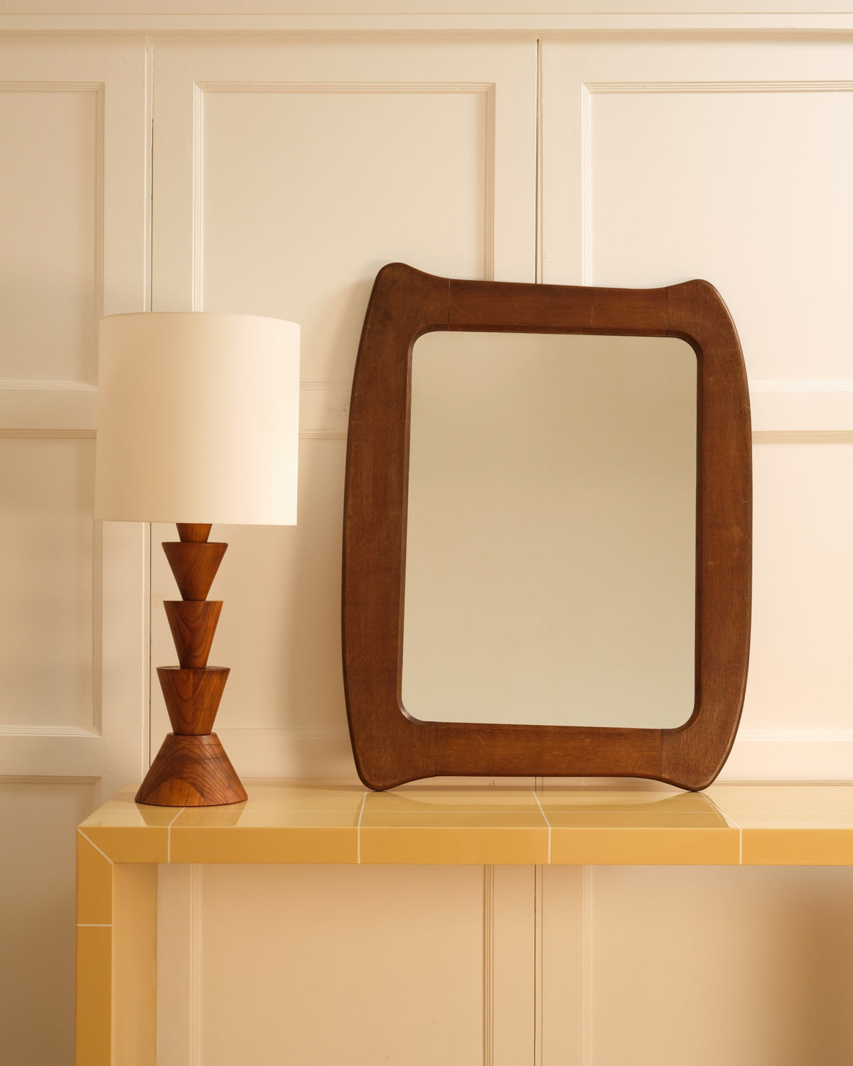 Wooden organic mirror — styled on yellow tiled console with lamp