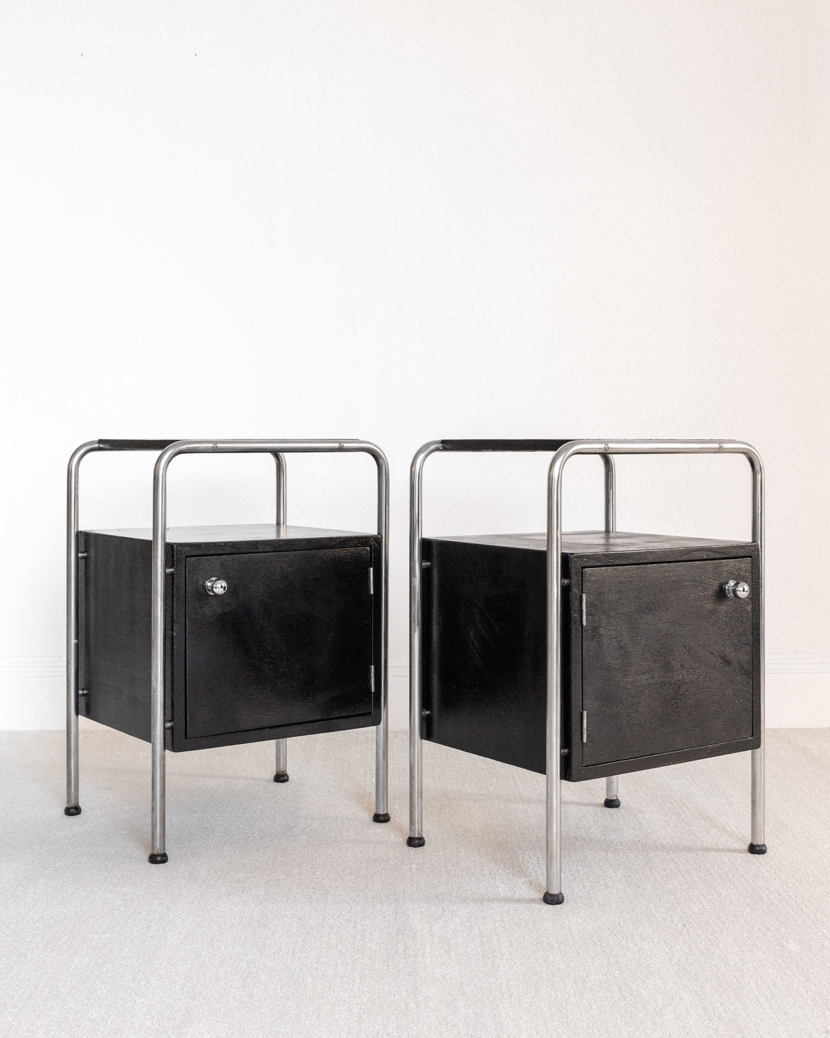 Pair of Functionalist Nightstands, Sweden 1930s — close-up of black wood and metal frame