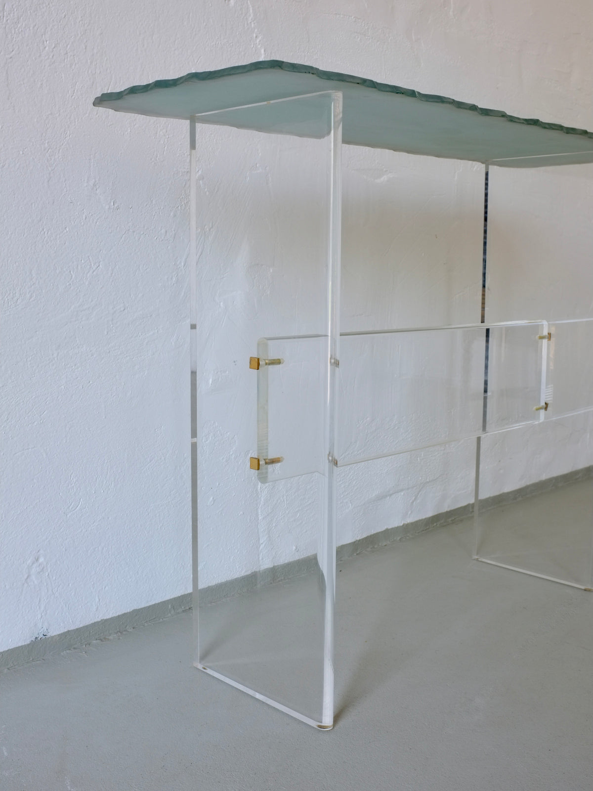 1980s Italian sculptural glass console with lucite frame