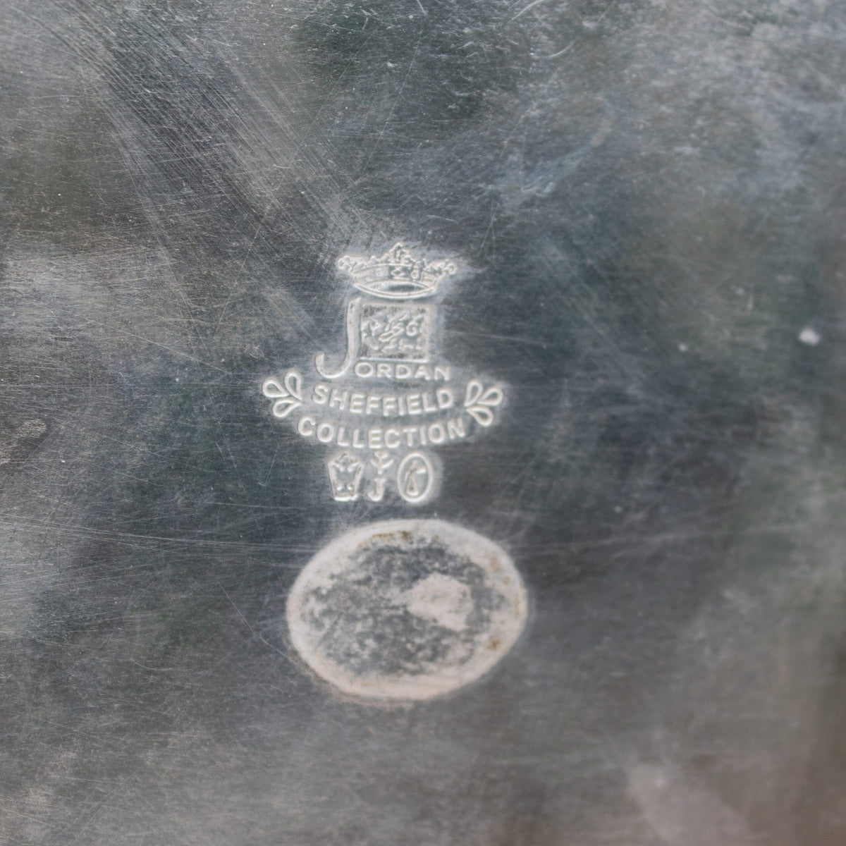 Jordan Sheffield Collection Silver Plated Vase — top view of engraved logo detail