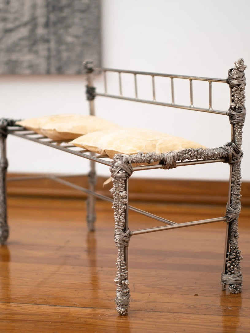 Fisherman' Bench — side angle showing metal frame with cushions