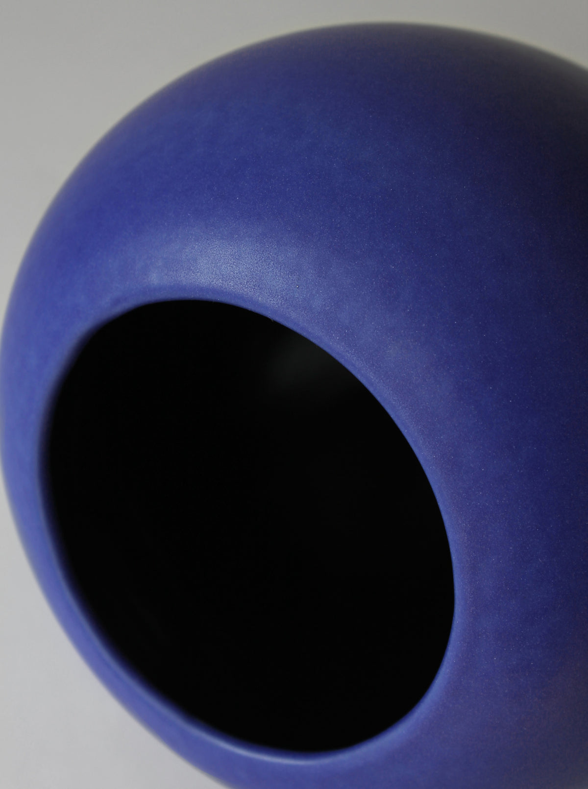 Interior view of cobalt blue ceramic vase showing curved walls