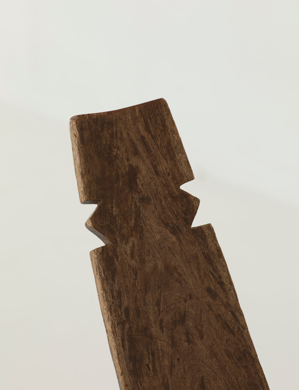 West African Monoxyle Lobi / Stargazer Chair, C. 1950 — close-up of carved wooden backrest