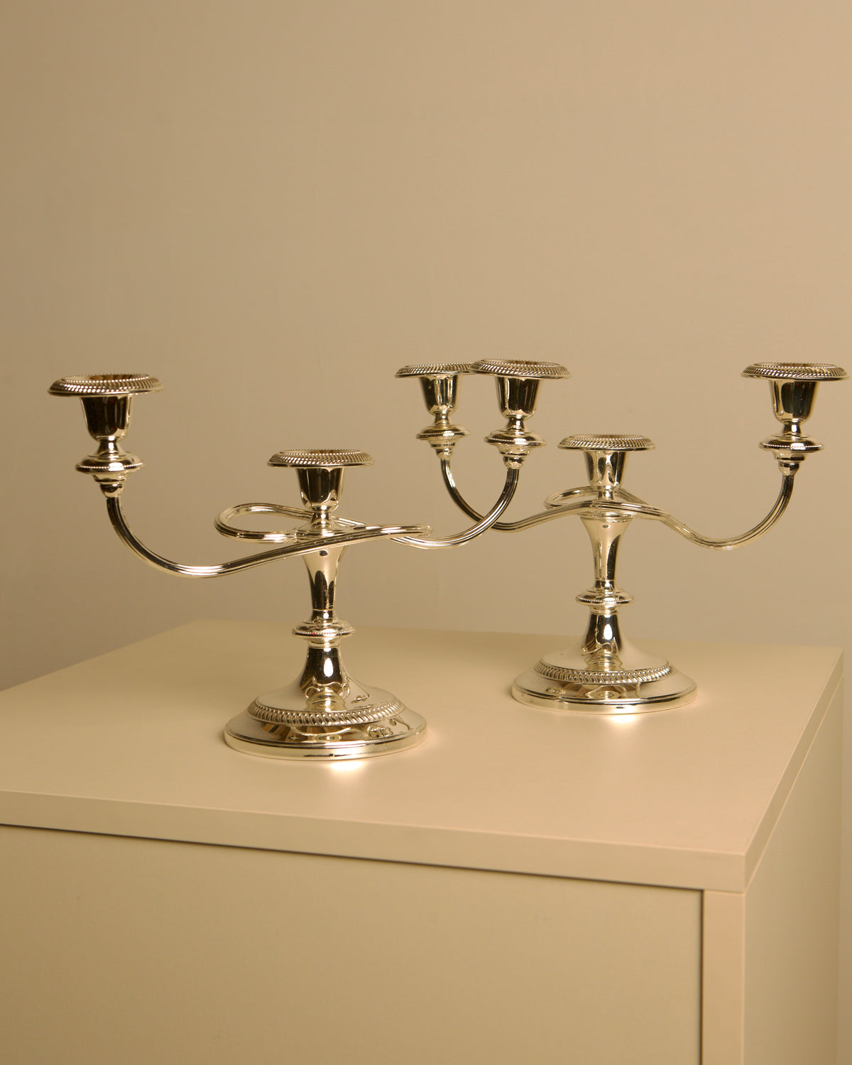 Pair of Italian metal "Medusa" candlesticks, 1980s by Treaptyque | The Oblist — polished silver finish