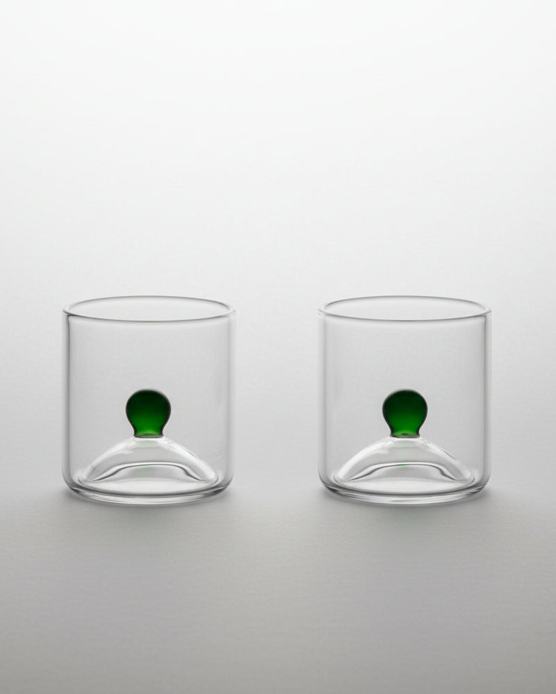 Two clear glass shot glasses with green sphere detail, Las Chicas duo