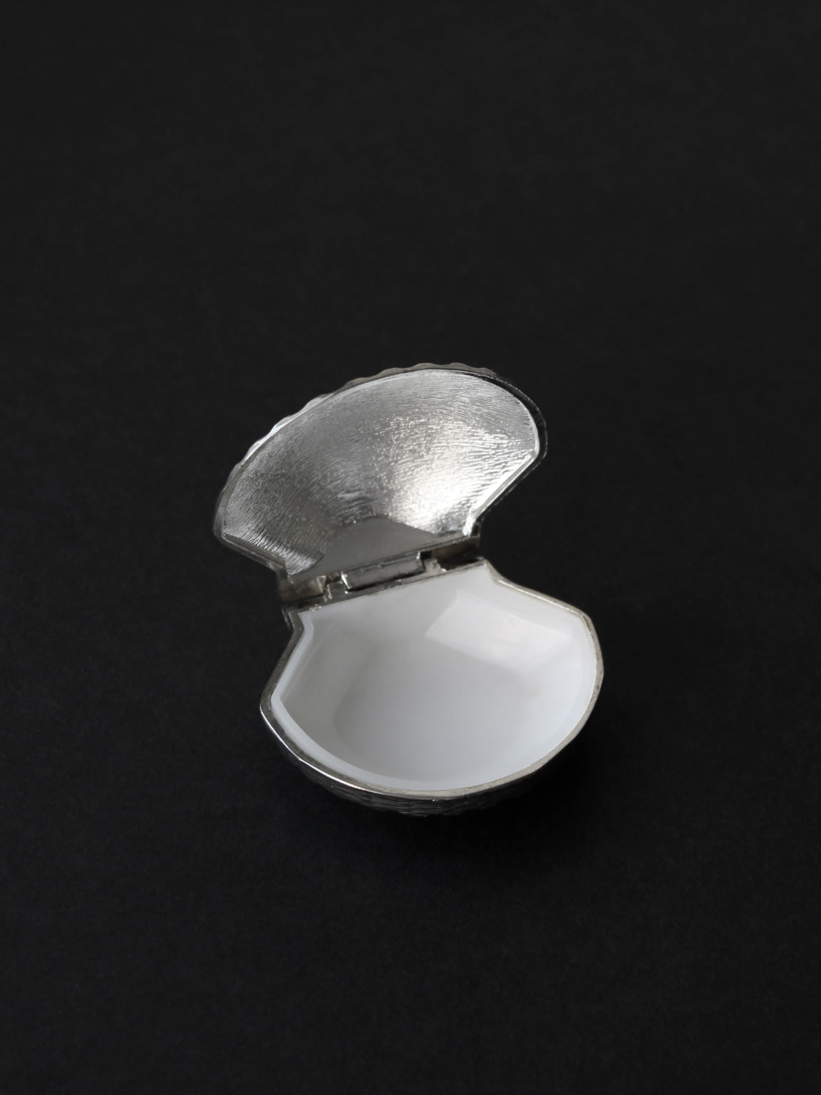 Open silver plated shell pill box showing white interior detail