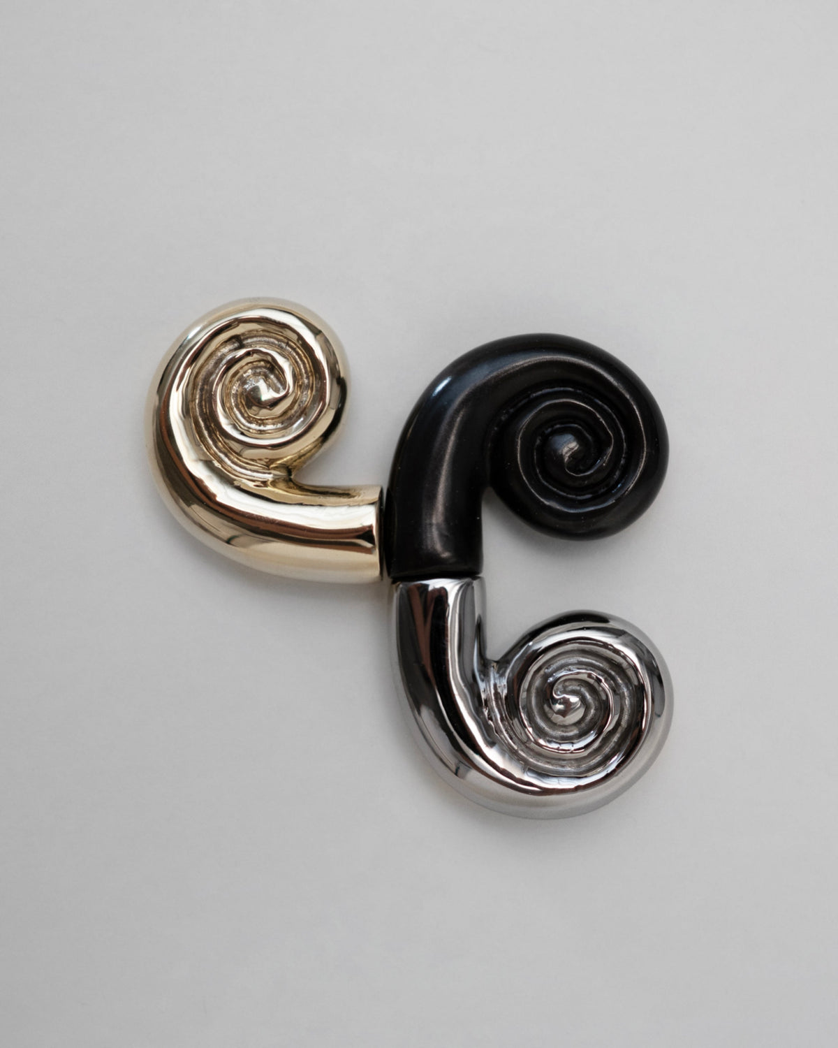 Noelle Knob - Brass — top view of brass and black swirl design