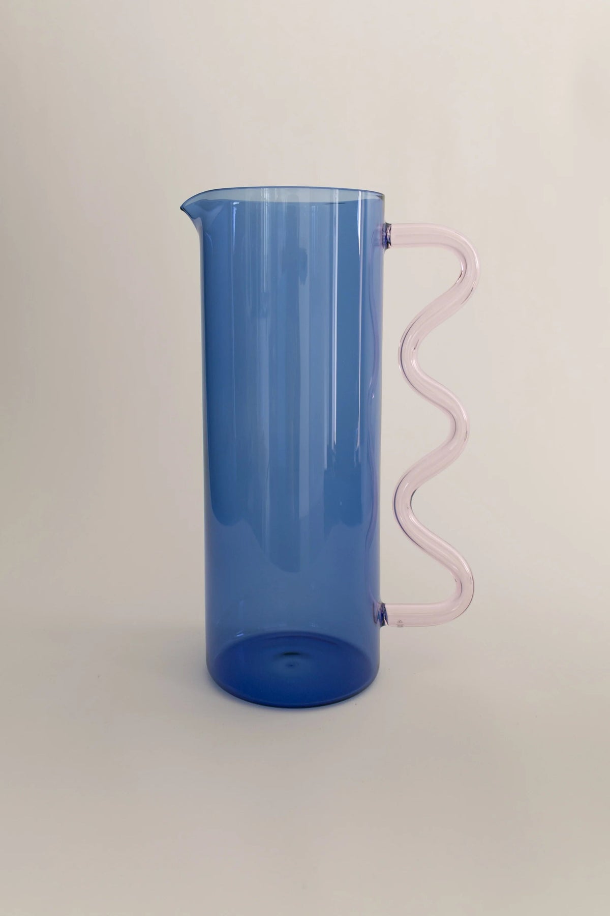 Wave Pitcher — side view highlighting blue body and pink handle