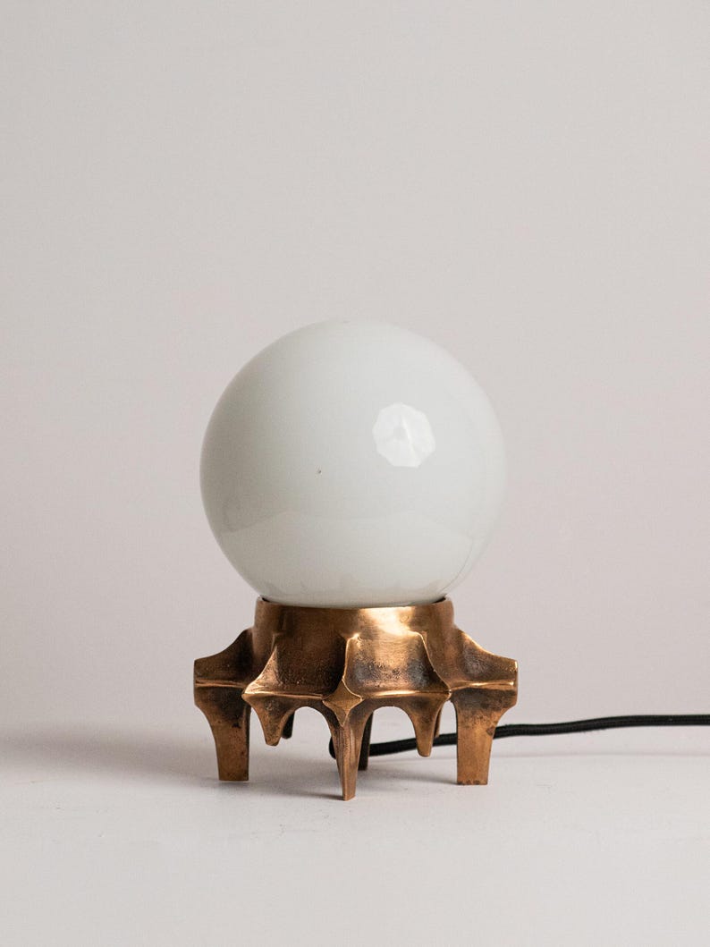 Brutalist Table Lamp, Tripod Cast Metal Base, Opaline Glass Globe Shade, 1970s by Studio Ecubed | The Oblist