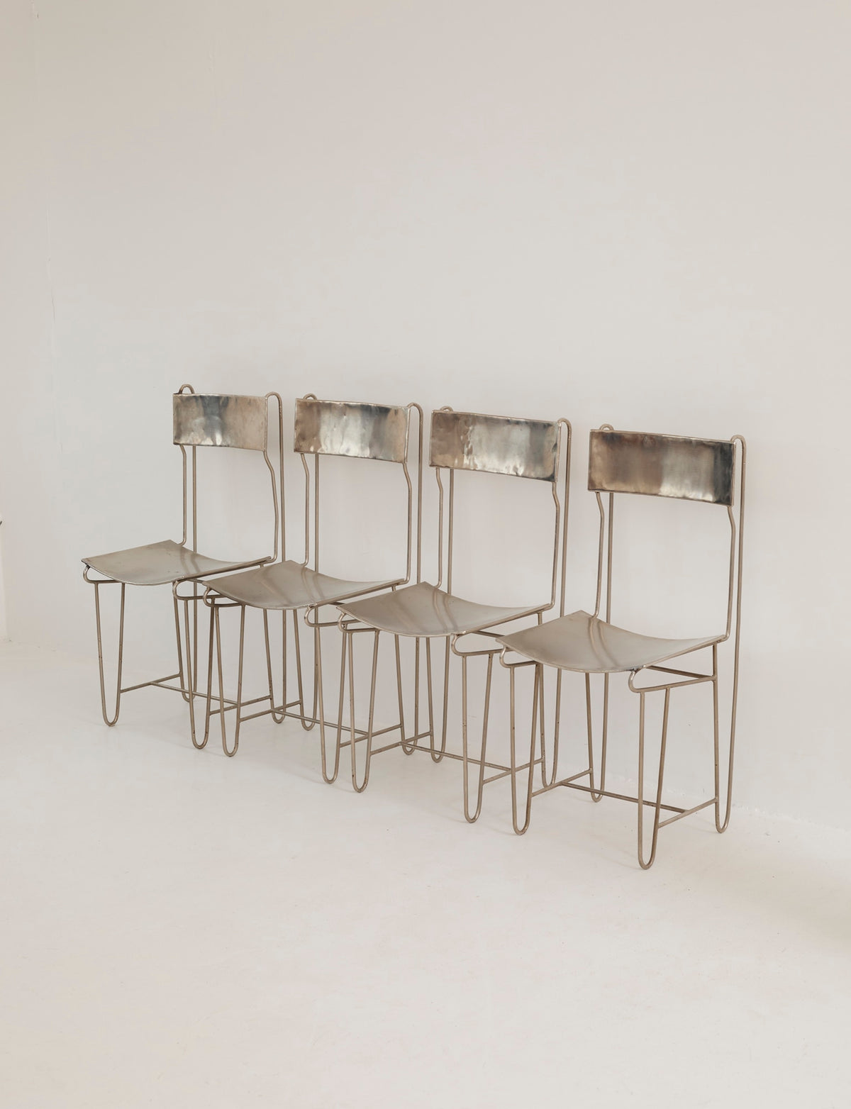 Set of 4 Metal Artist Dining Chairs from France Circa 1960-70 — side angle showing metal frame and minimalist design