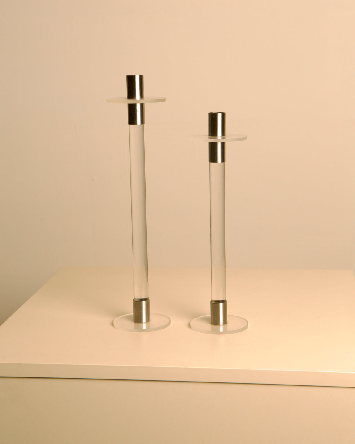 Pair of Italian Lucite and silver candleholders from the 1970s