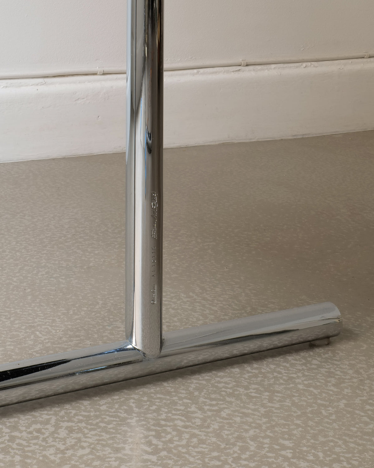 Chrome base detail of Lou Perou extendable table by Eileen Grey