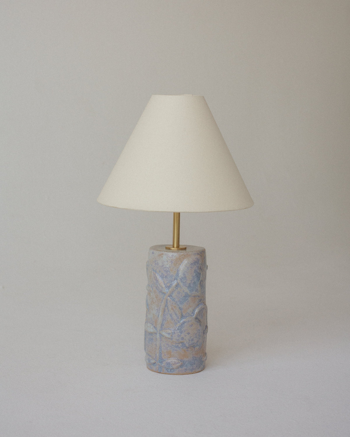 Folklore table lamp with textured ceramic base and cream shade in misty lavender