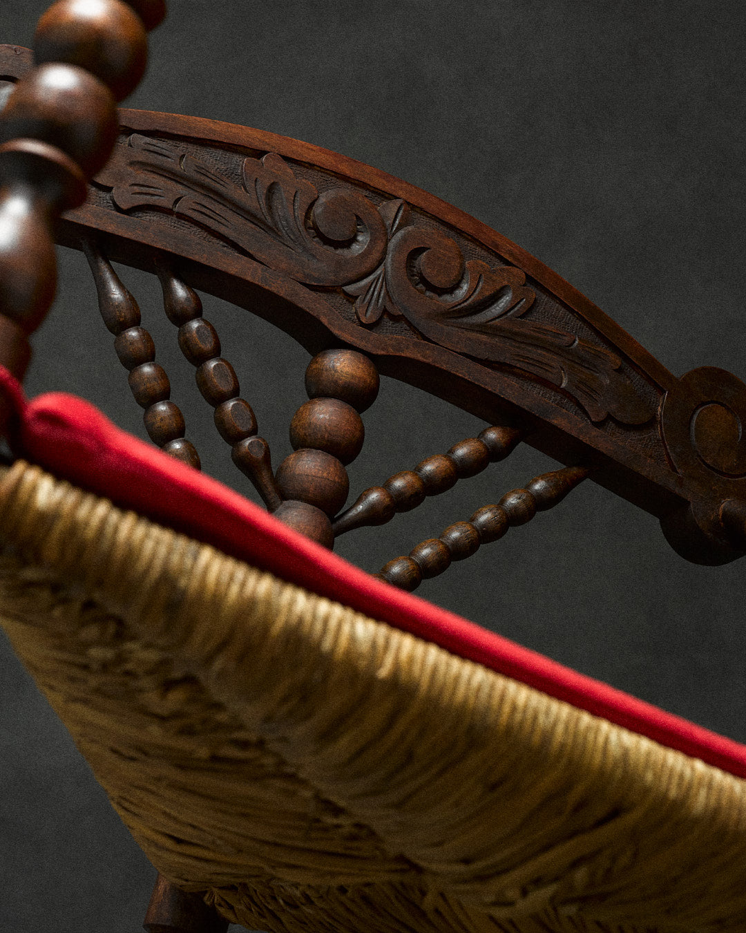 triangular bobbin chair — angled view of carved wooden backrest
