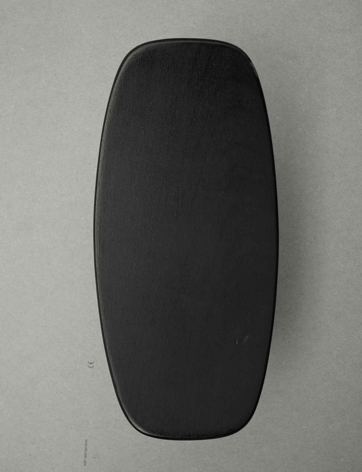 Alain Gaubert meditation stool in black solid beech, France c. 1980 — lifestyle setting