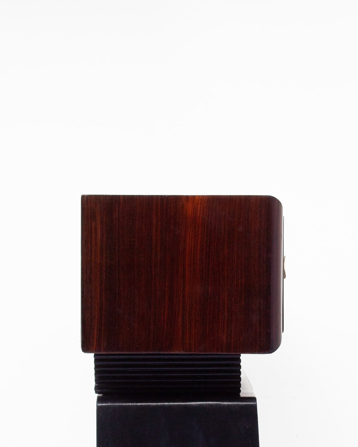 Art Deco console detail showing mahogany veneer and stepped base
