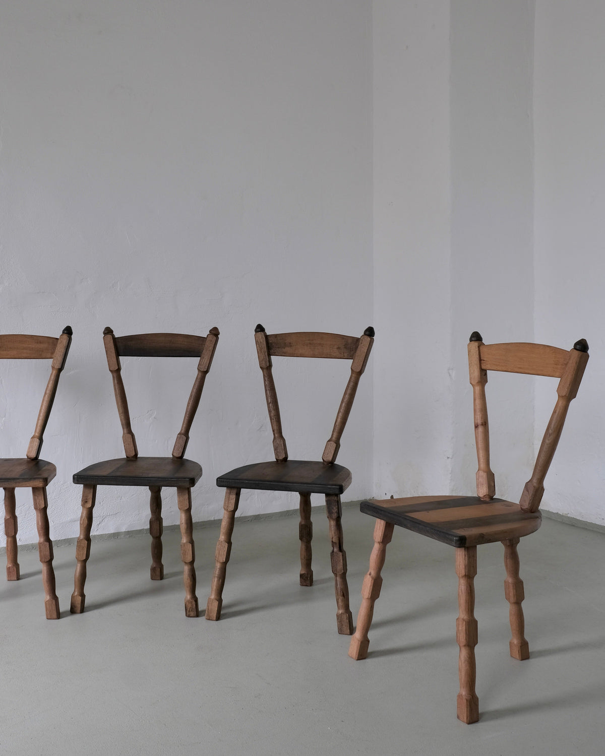 Brutalist sculptural tripod dining chairs 1970s arranged view