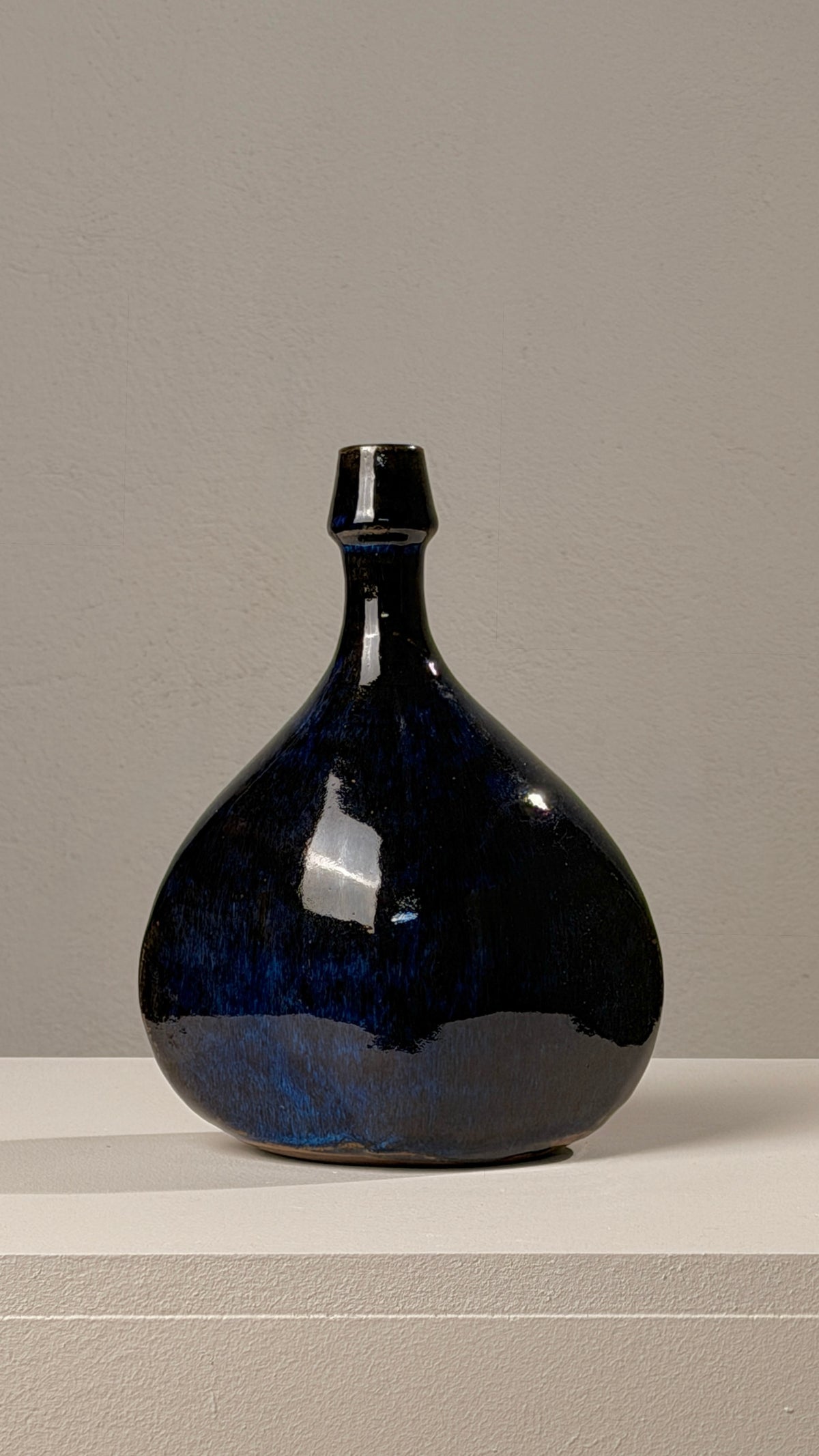 Ceramic vase/bottle, Atelier les Cyclades, Anduze, 1970. — side view highlighting glossy dark blue glaze