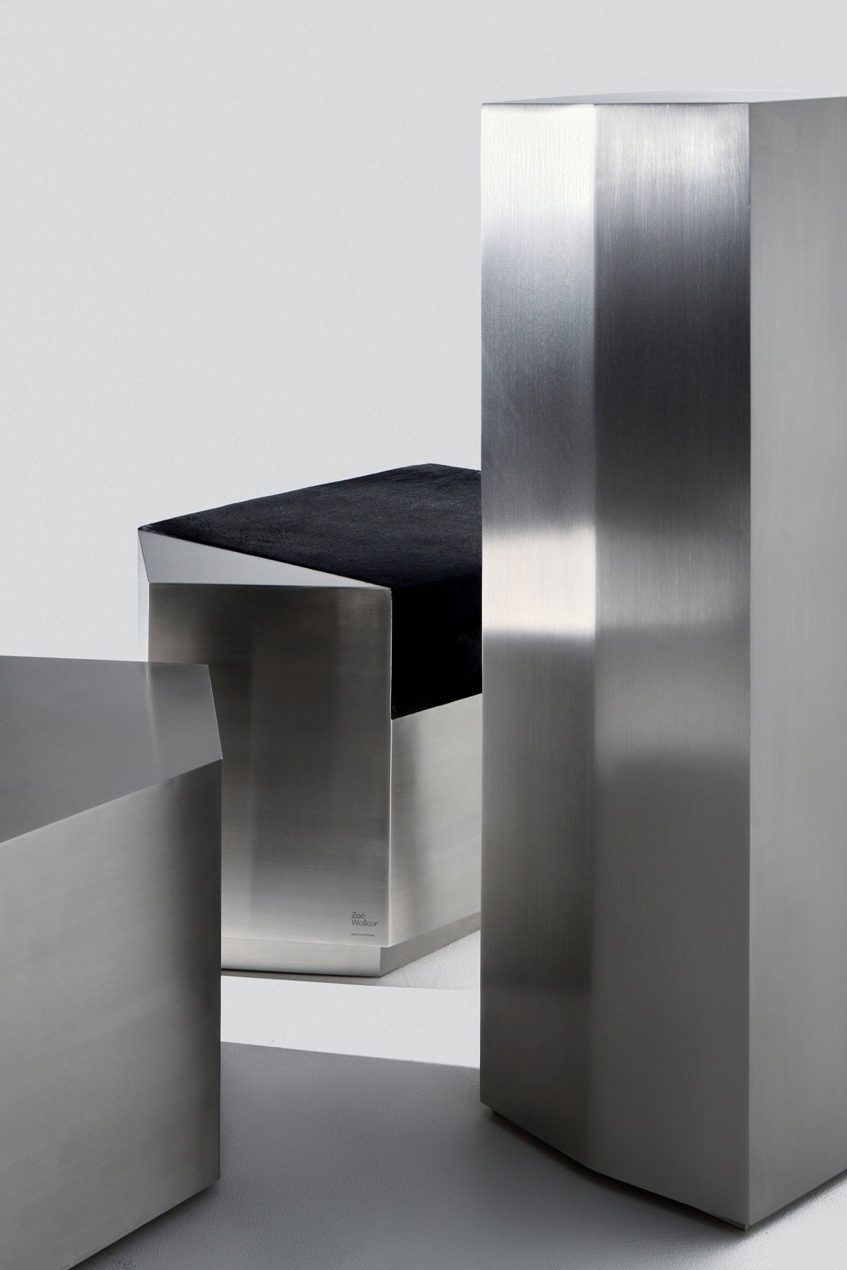 Ame II' Steel Pedestal — angled view of polished steel surface