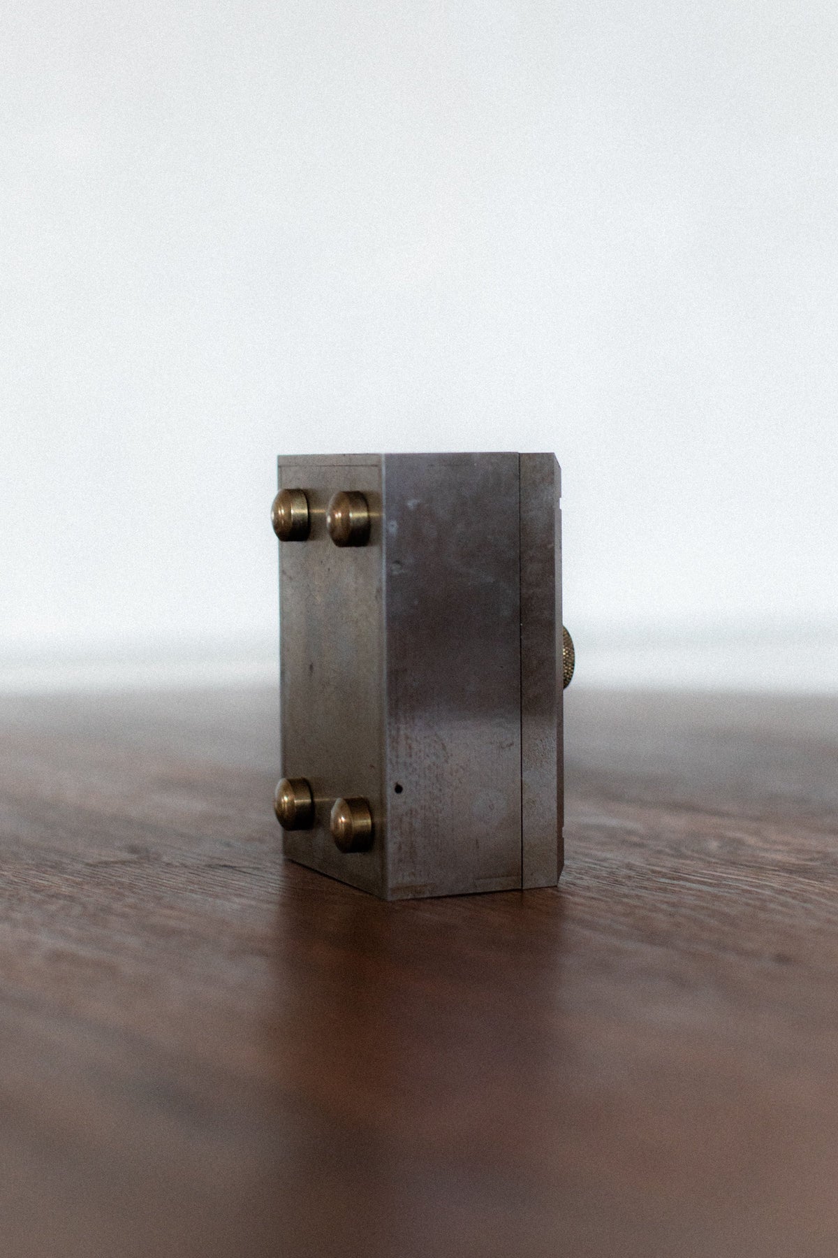 Industrial steel box with brass corner bolts detail view