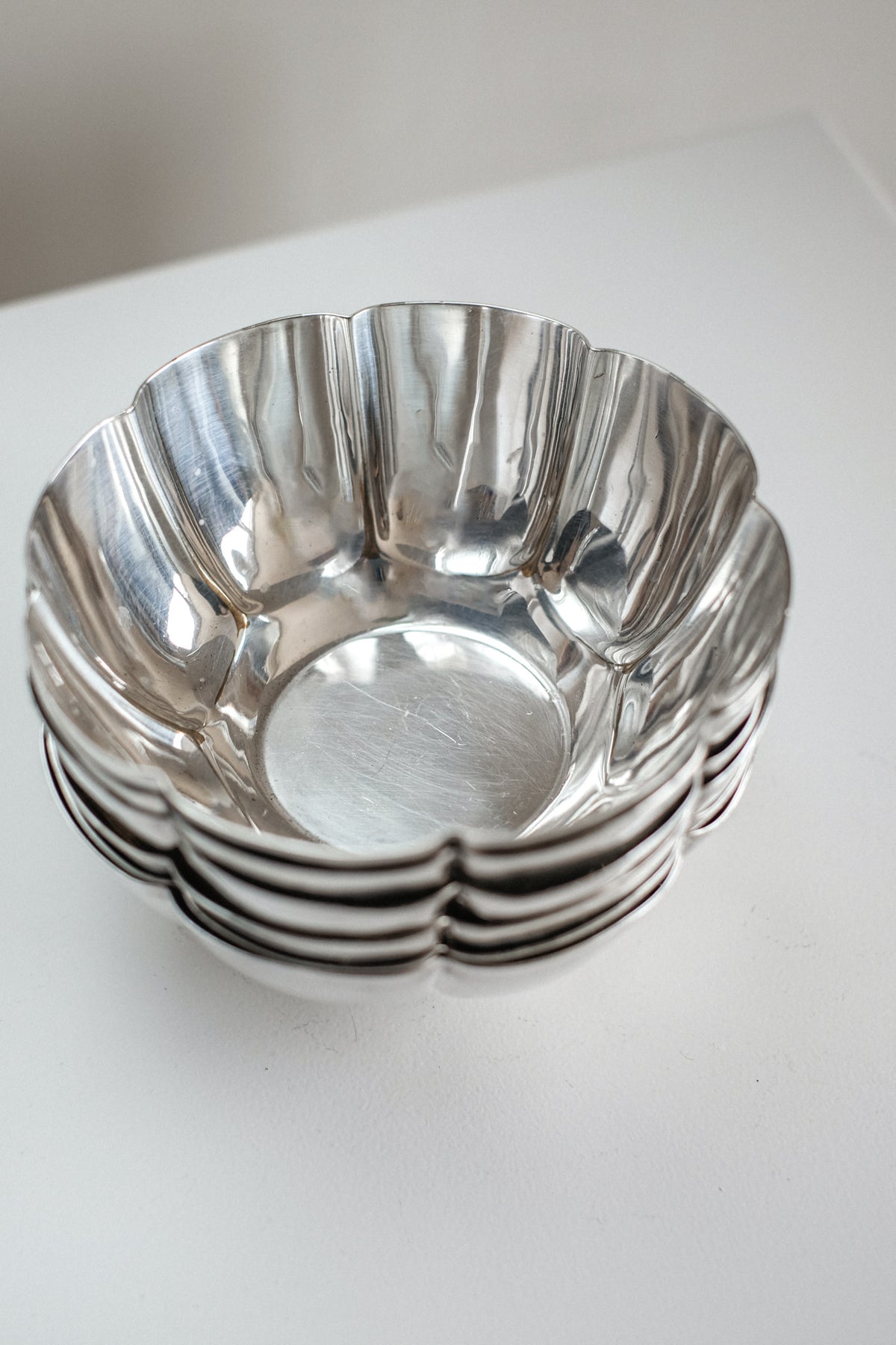 Set of 6 Silver-Plated Bowls 1960s — angled view showing reflective surface