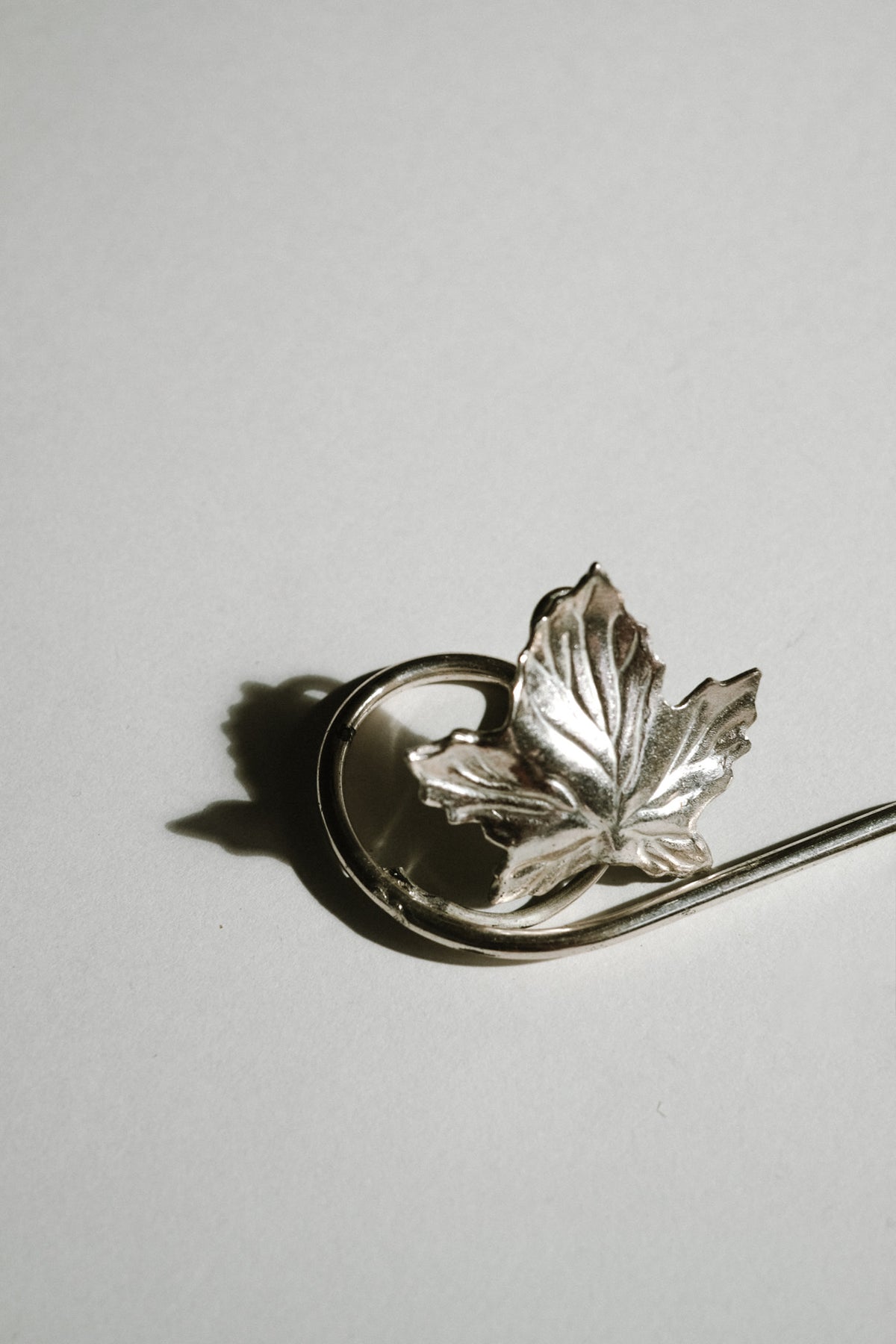 Silver-plated maple leaf candle holder detail view