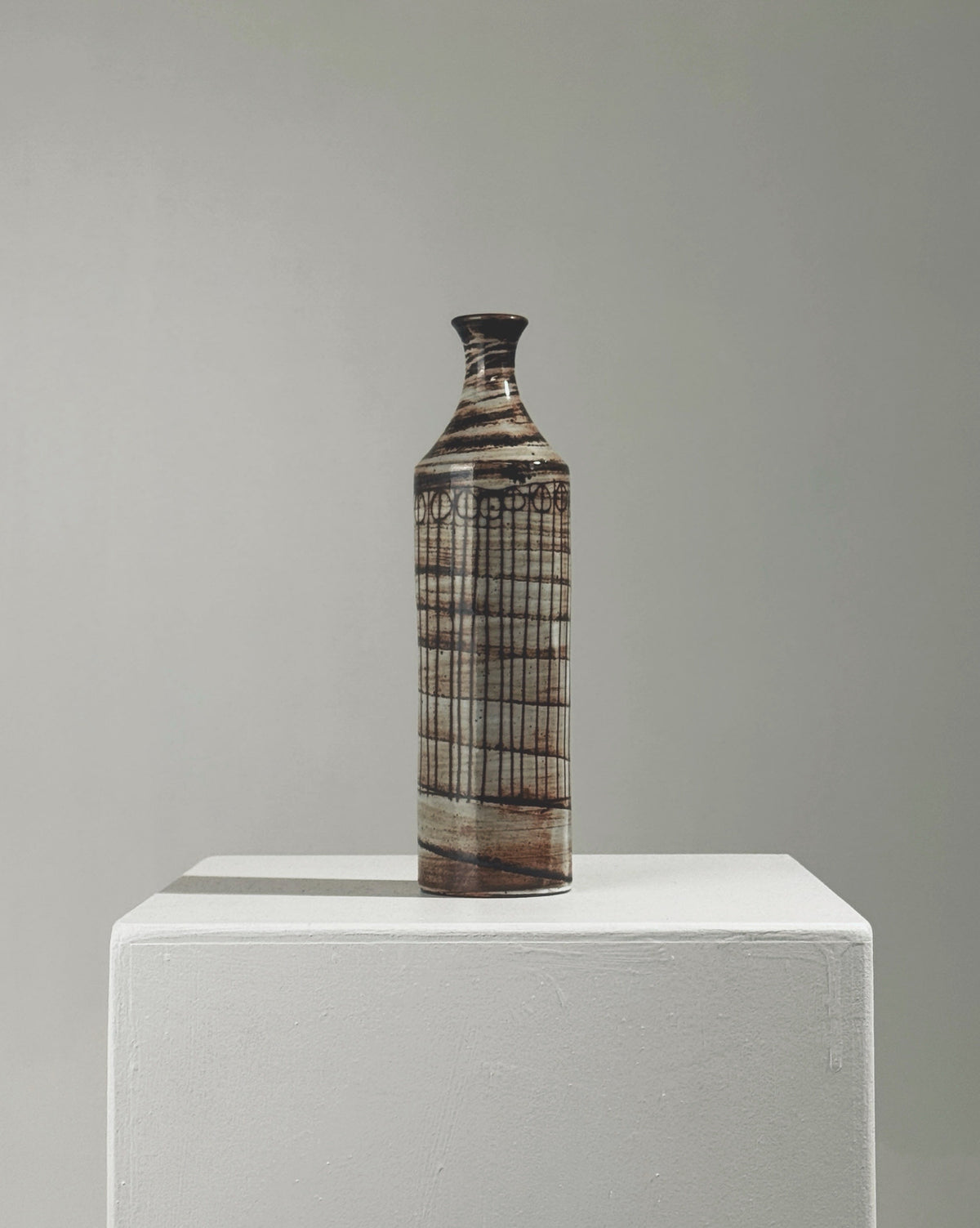 Ceramic soliflore vase by Jacques Pouchain with geometric grid pattern