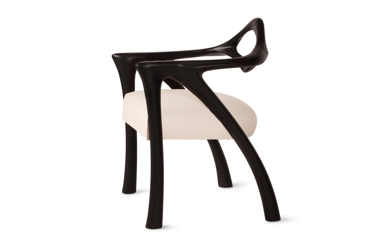 Darcey Armchair in Ash wood by Amorph — angled view highlighting curved legs and seat