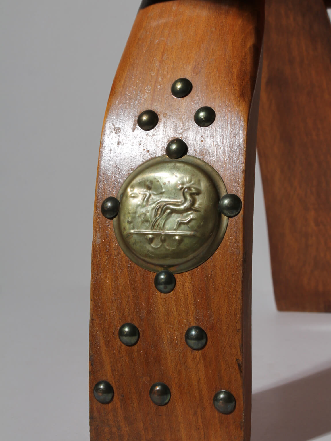 Egyptian Ottoman Camel Saddle Stool — close-up of wooden leg with brass details