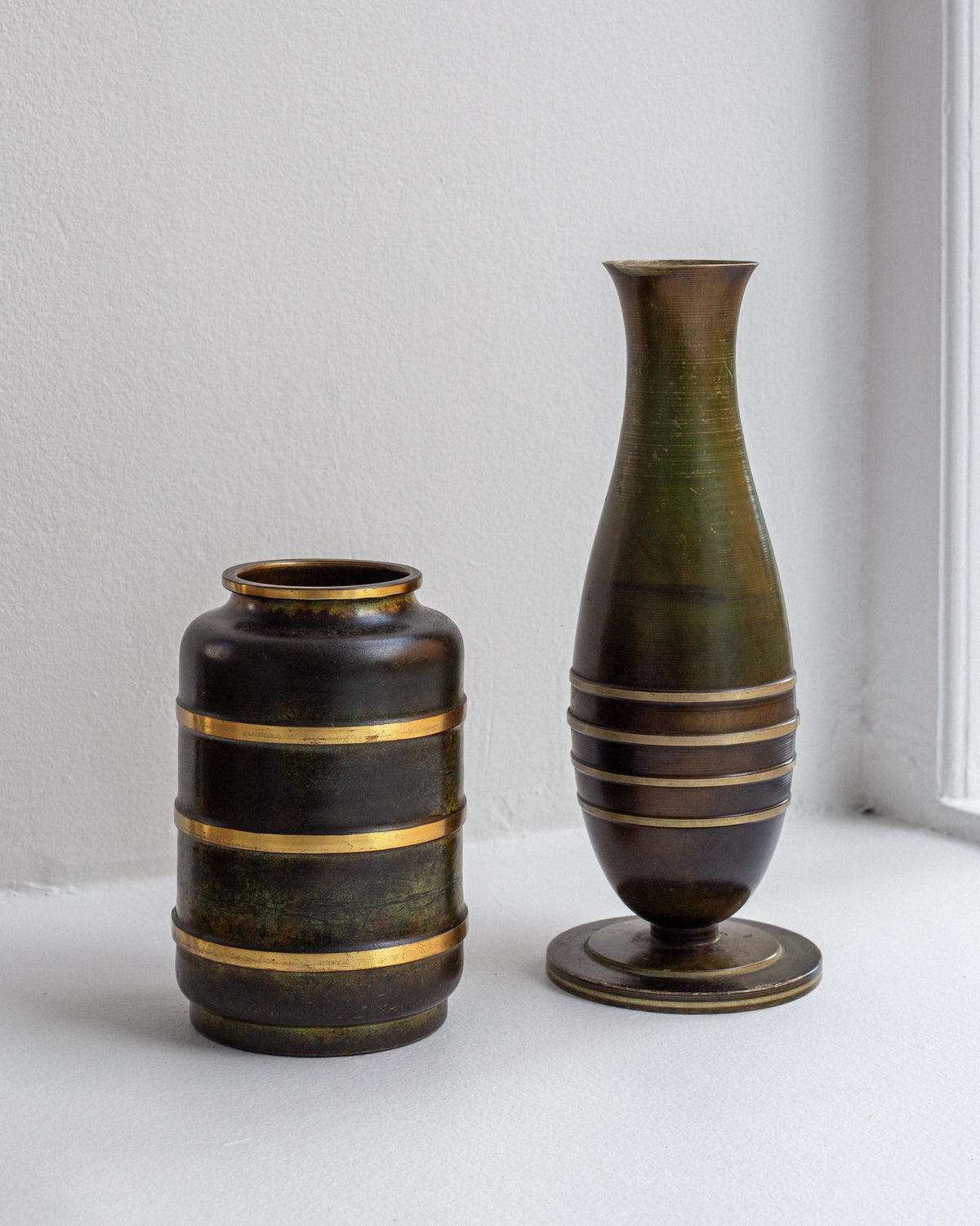 Modernist bronze brass vases with gold bands detail view