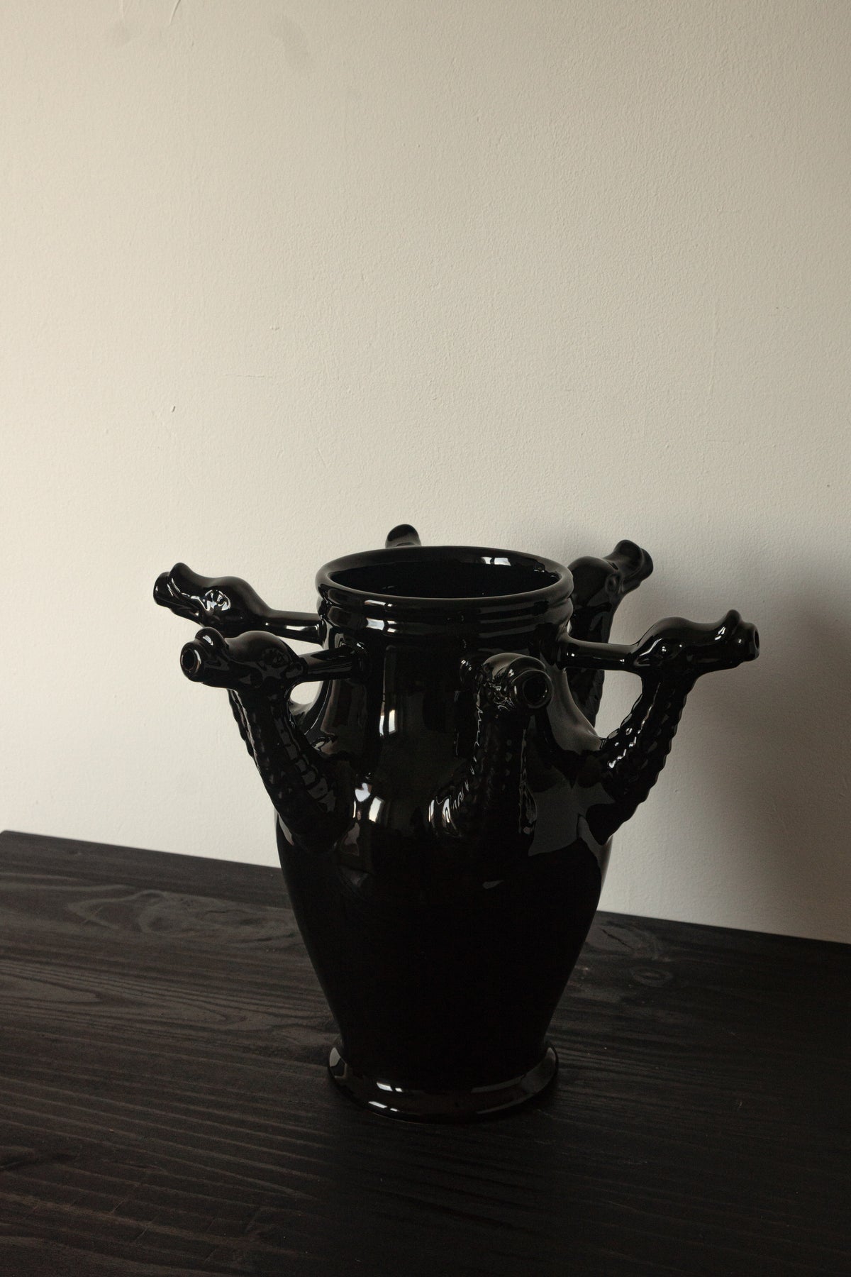 The Drago Nero - Minimalist Vase in Ceramic — side angle showing black ceramic with dragon handles