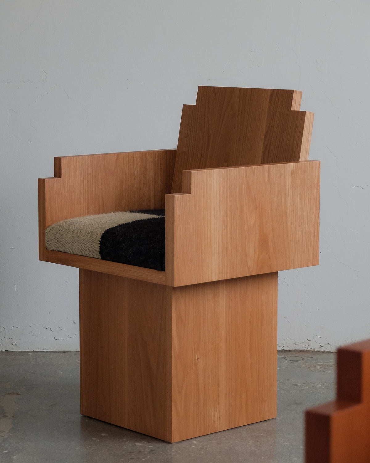 Frankie Chair — side angle showing wooden frame and upholstered seat