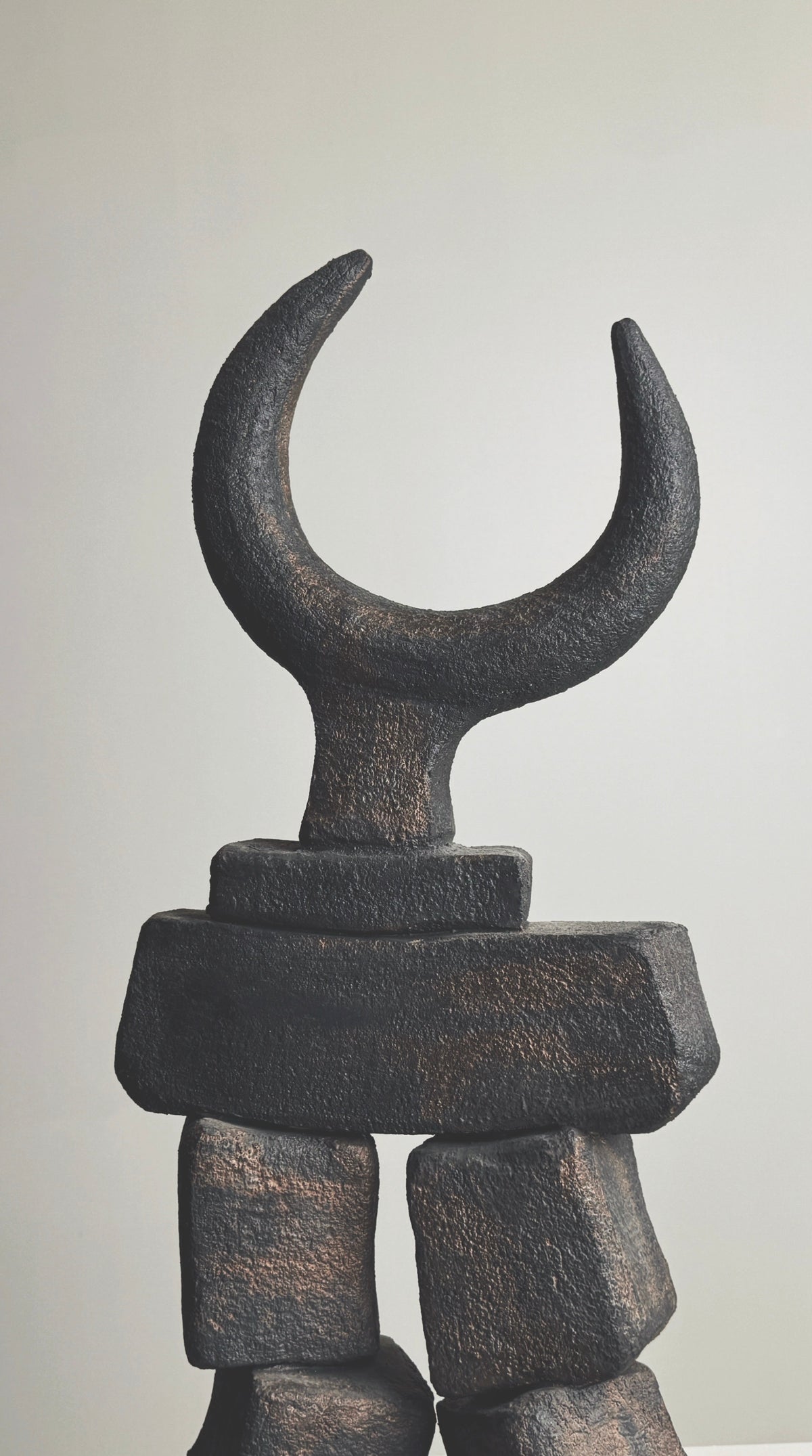 Dark bronze sculptural totem with crescent moon form by Pouchain