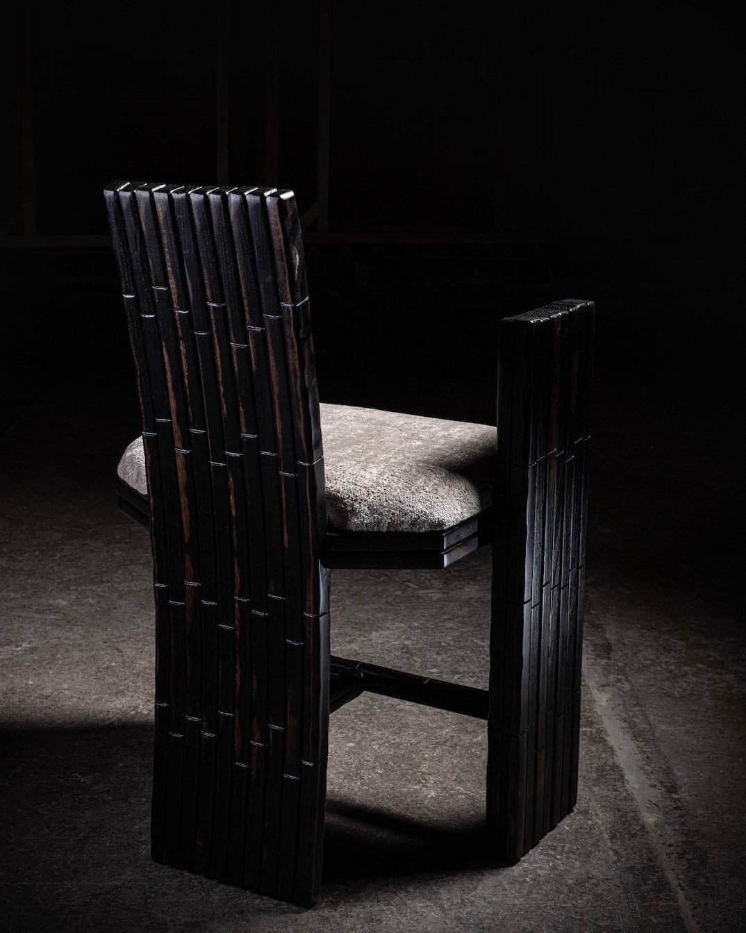 Mr B armchair with vertical bamboo slats and cushioned seat