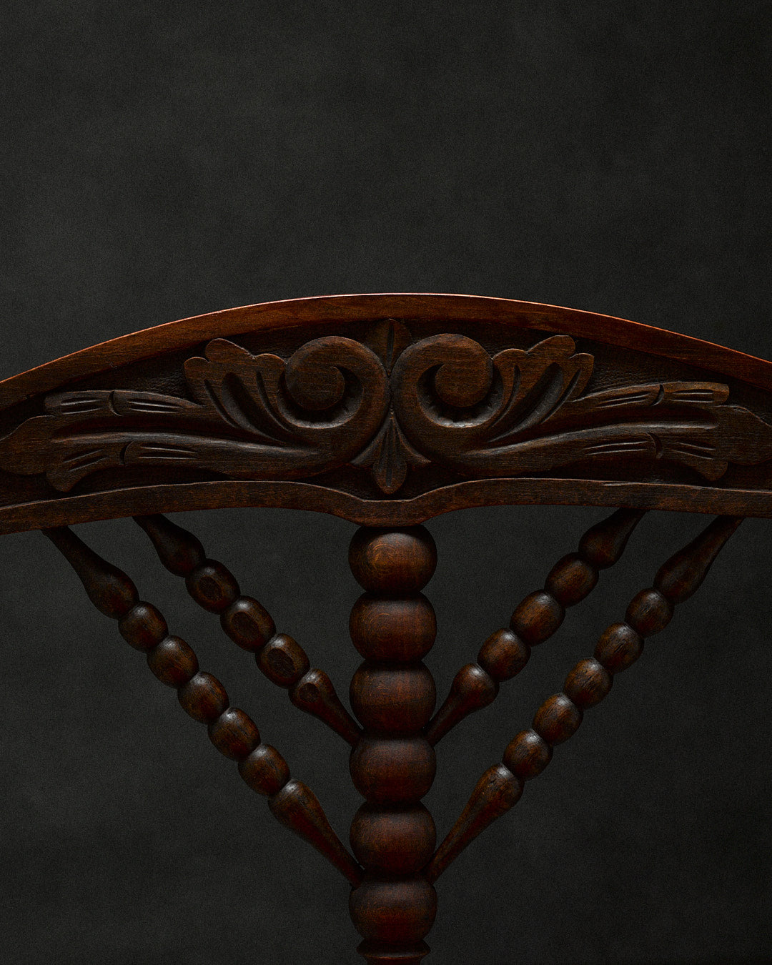 triangular bobbin chair — top view of carved wooden backrest