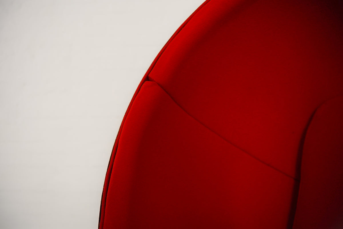 Red Ball Chair by Eero Aarnio showing curved fiberglass shell detail