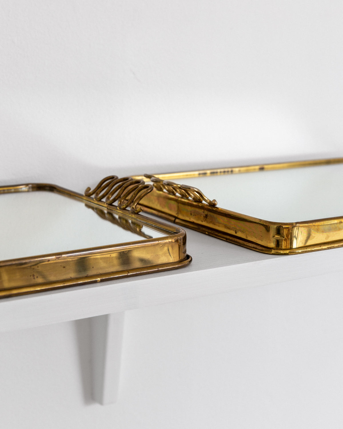 Pair of Scandinavian Modern Brass Mirrored Trays, 1950s–60s — back view showing brass frame and mirror surface