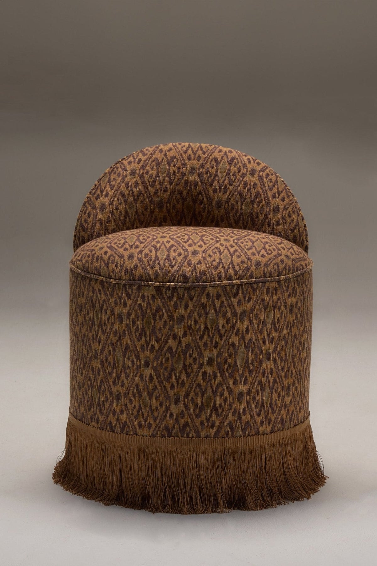 INFERI STOOL - WOVEN IKAT — side angle highlighting woven fabric and fringe