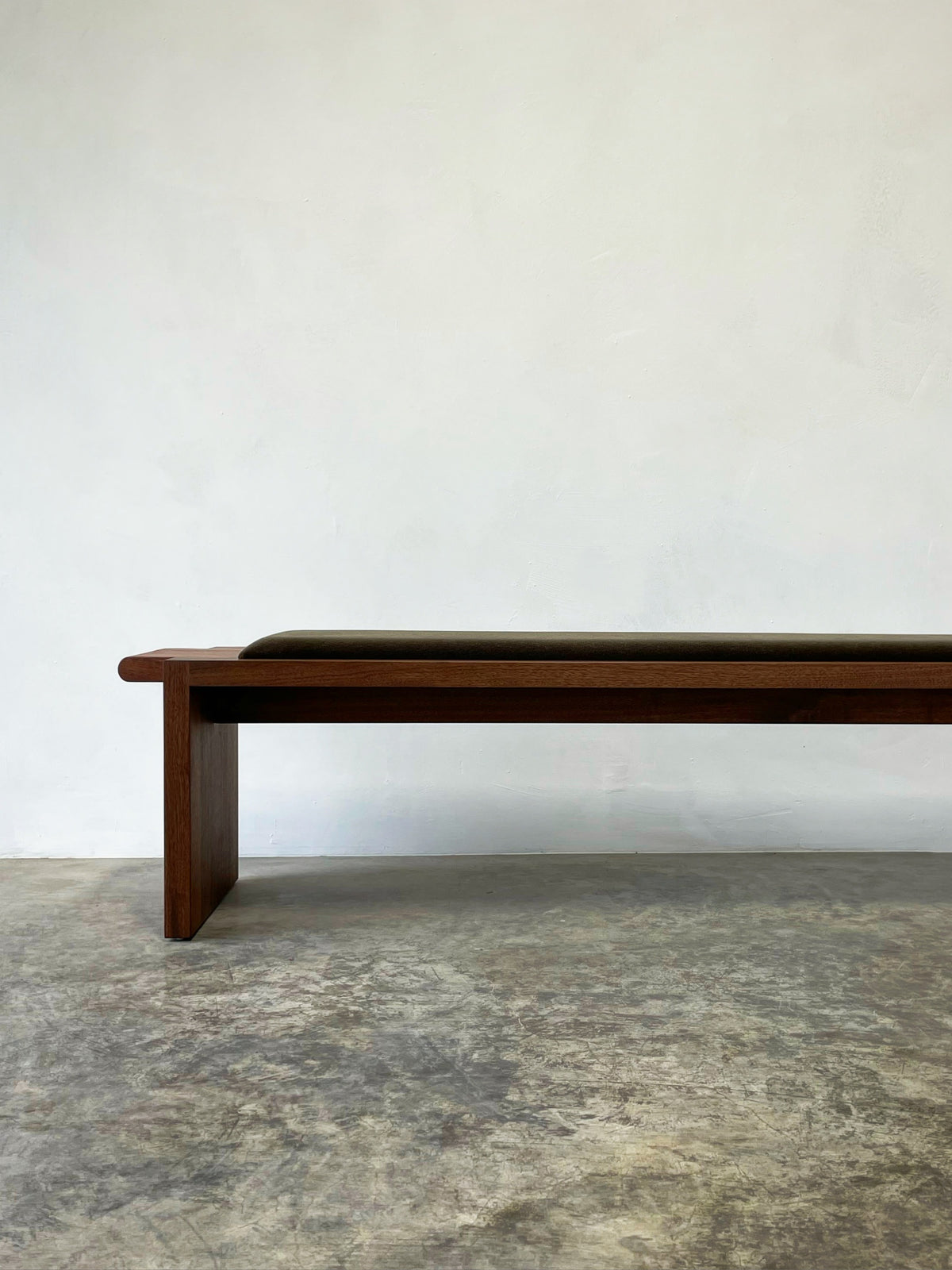 Upholstered Plank Bench — side angle showing dark wood frame