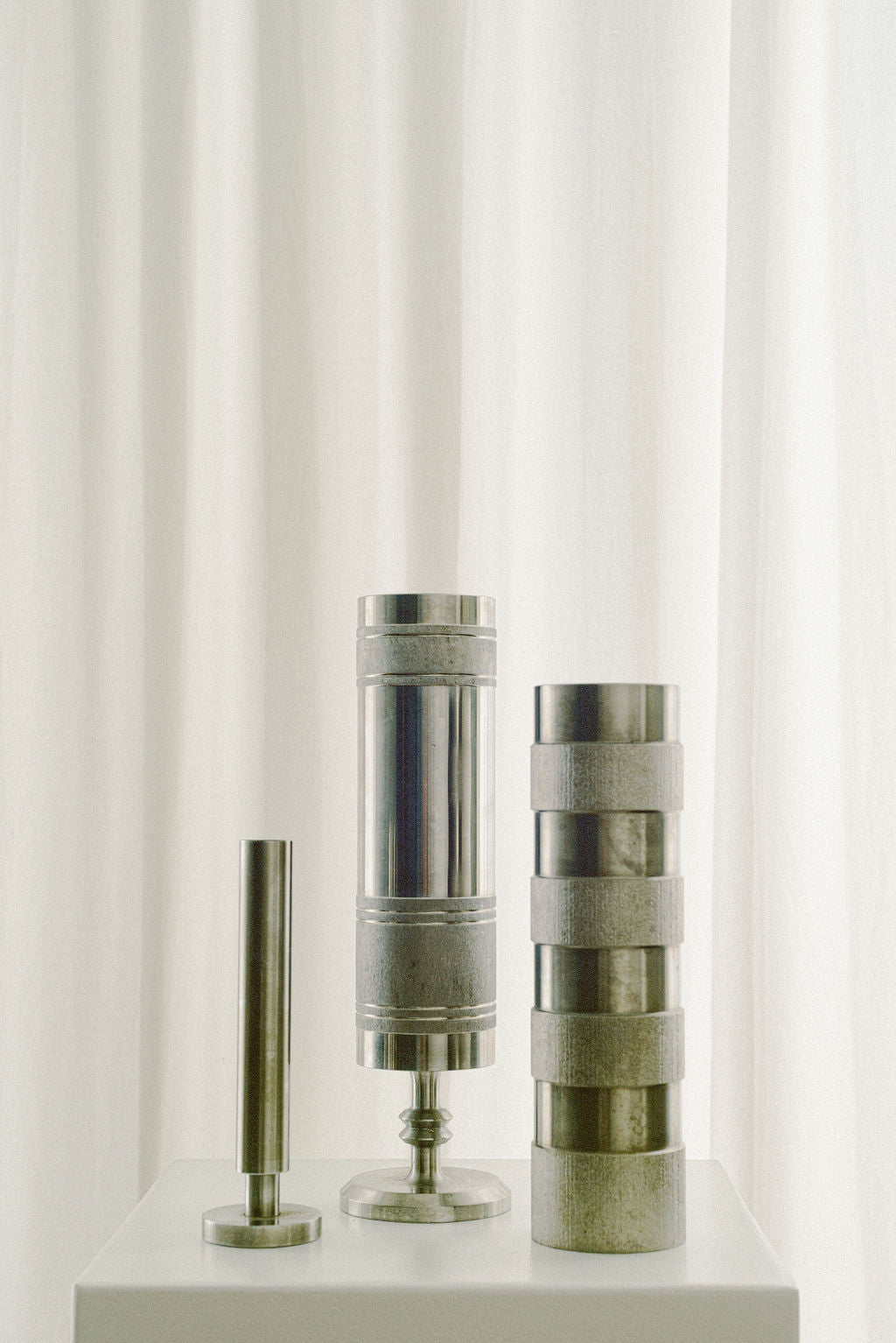Stainless Steel Brutalist Rod Vase — close-up of textured surface and base