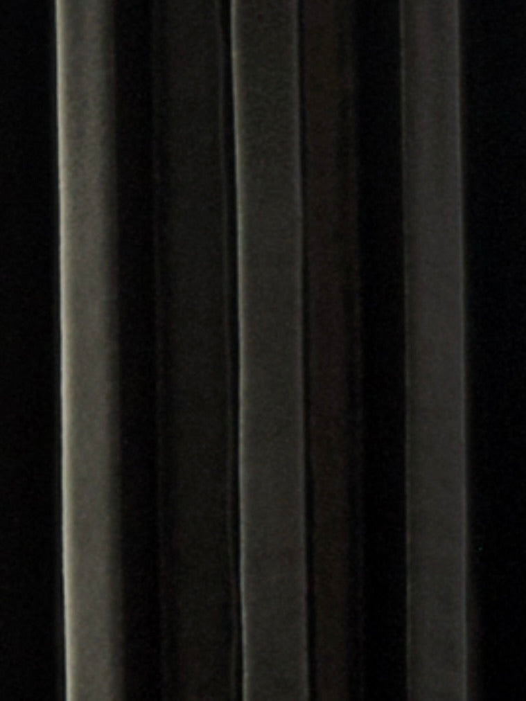 A close-up of dark, vertical velvet panels with soft folds and highlights, showcasing the elegant texture of Vessel No. III by Devin Wilde.