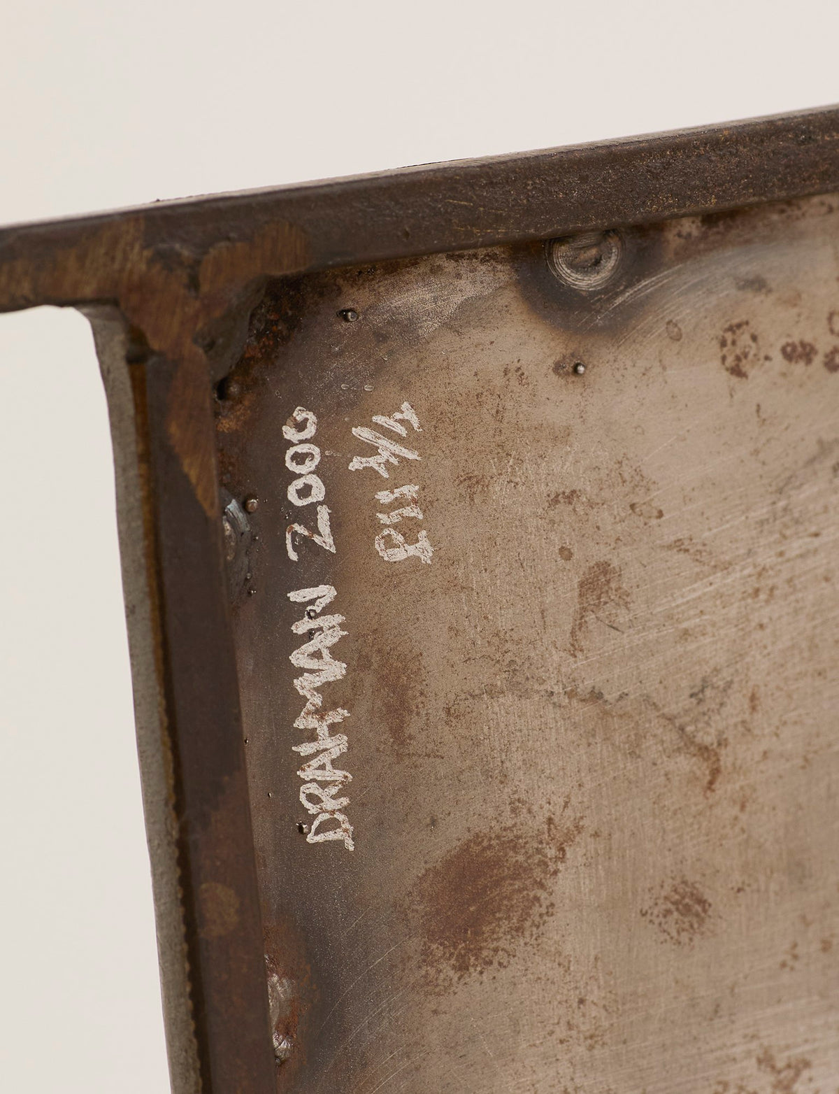 Unique Signed Artist Bench / Settee in Metal — close-up of rusted metal surface