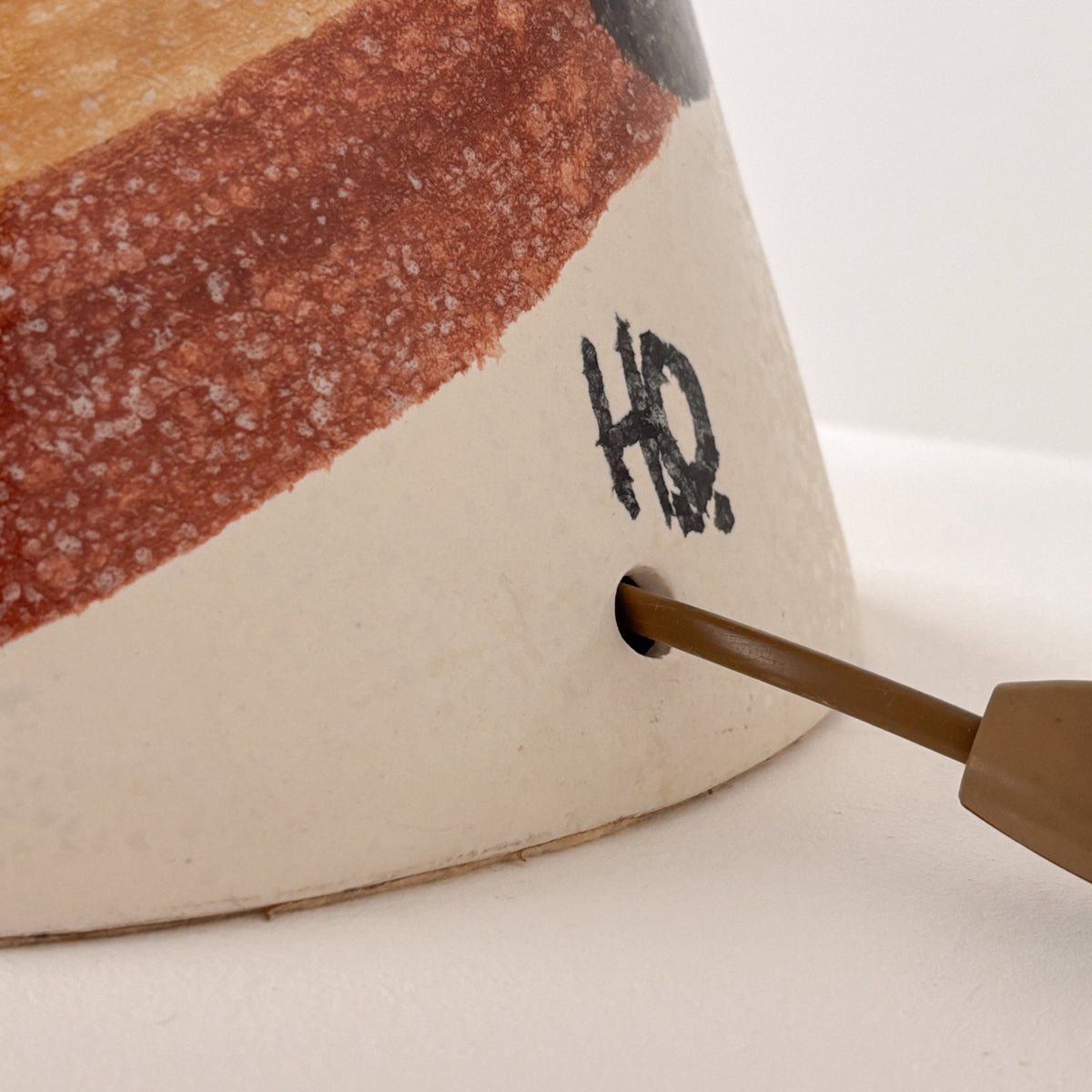 Detail of HO ceramic lamp signature and brass handle on base