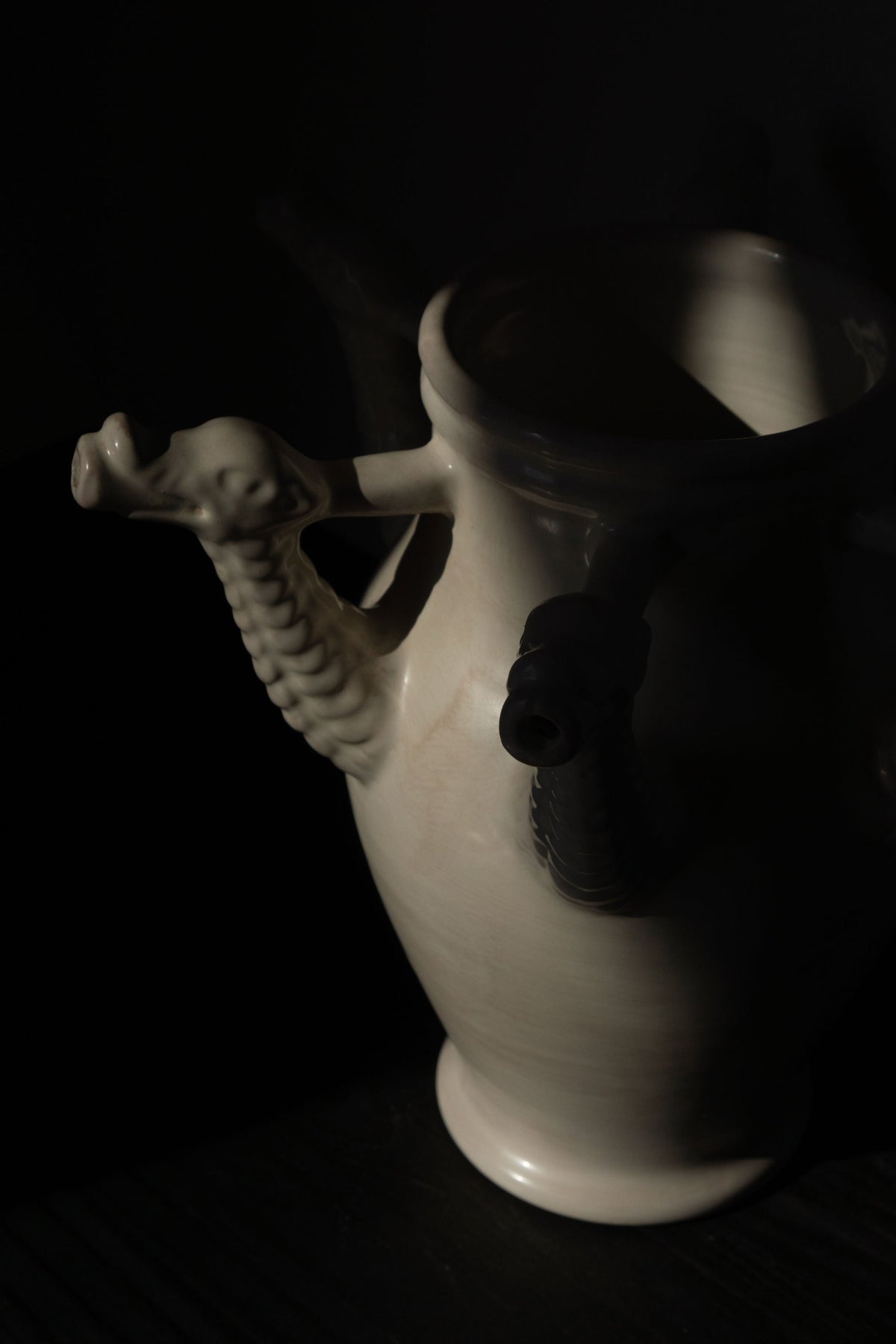 The Drago Bianco - Minimalist Vase in Ceramic — side angle with ceramic texture and dragon handles