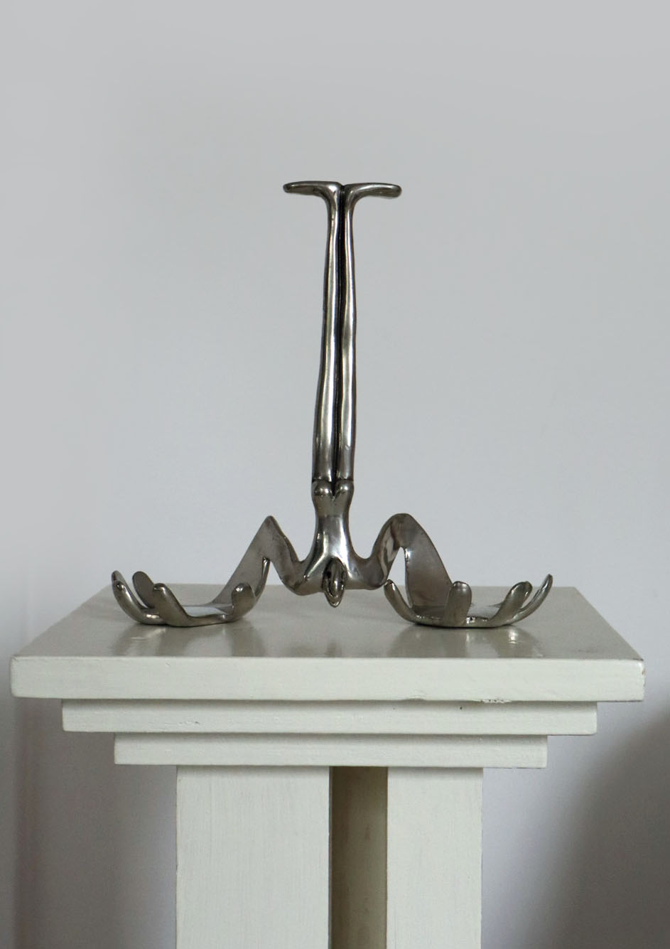 Carrol Boyes Sculptural Bottle Holder in Polished Metal — lifestyle setting