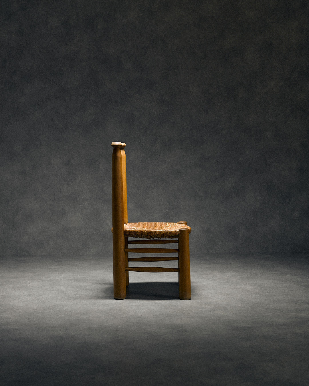 low chair with rush seat, attributed to Charles Dudouyt — side angle