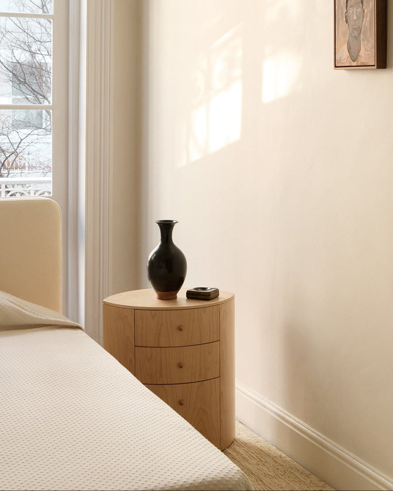 Observer natural birch nightstand with dark ceramic vase in bedroom