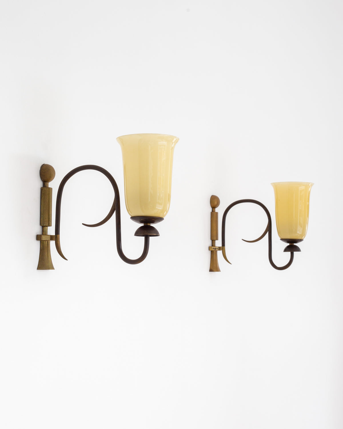 Pair of Art Deco wall sconces with amber glass shades, 1930s
